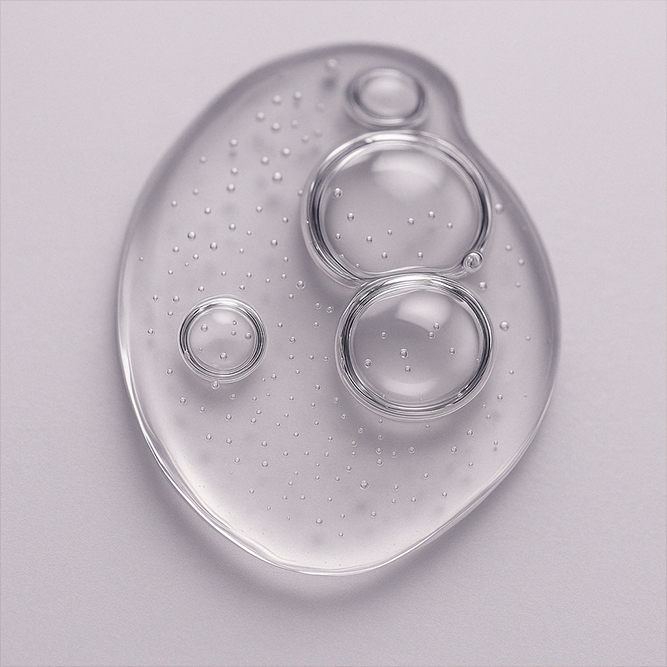 Gelige Textur mit Luftblasen des schöne Augen Roll-On Serum